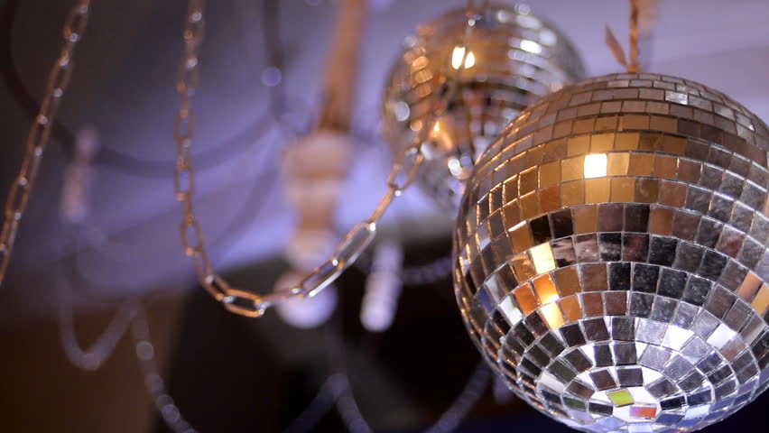 Mirror Disco Ball With Light Reflection On The Ceiling On A Black