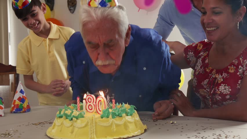 Group Of Old Friends And Family Celebrating Senior Man Birthday In ...