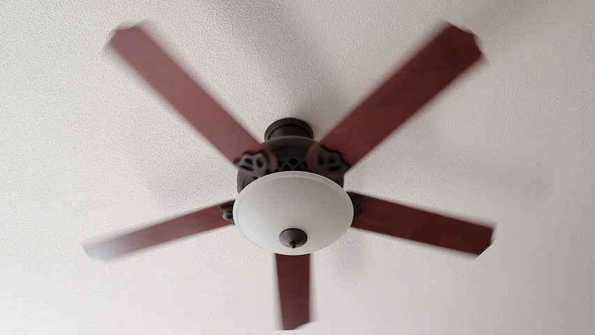 A Ceiling Fan Turns Slowly With Light Stock Footage Video 1967935 A Ceiling Fan Slowly Spins On Low Setting Hd Stock Video Clip