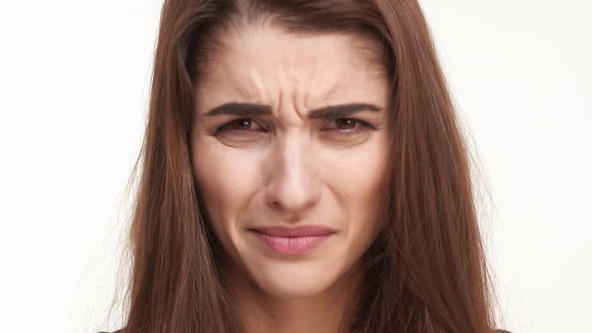 A Young Woman Looks Directly Into The Camera With A Blank Stare. Close ...