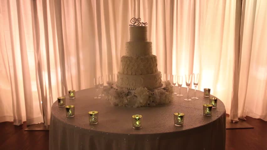 Cake Table At Wedding Reception With Love Topper And Candles