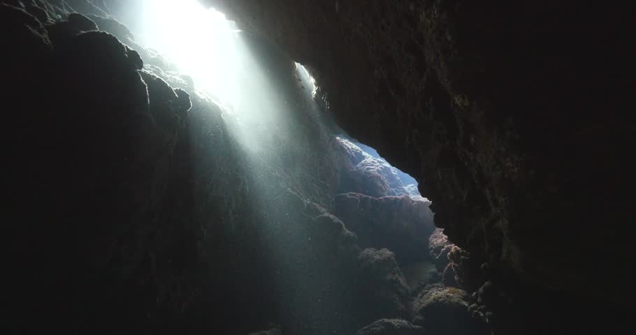 Bright Grotto Ceiling Opening, Dark Walls And Narrow Passage, High ...