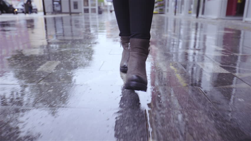 Many People Walking On A Rainy Day With Wet Shoes In The City With Rain ...