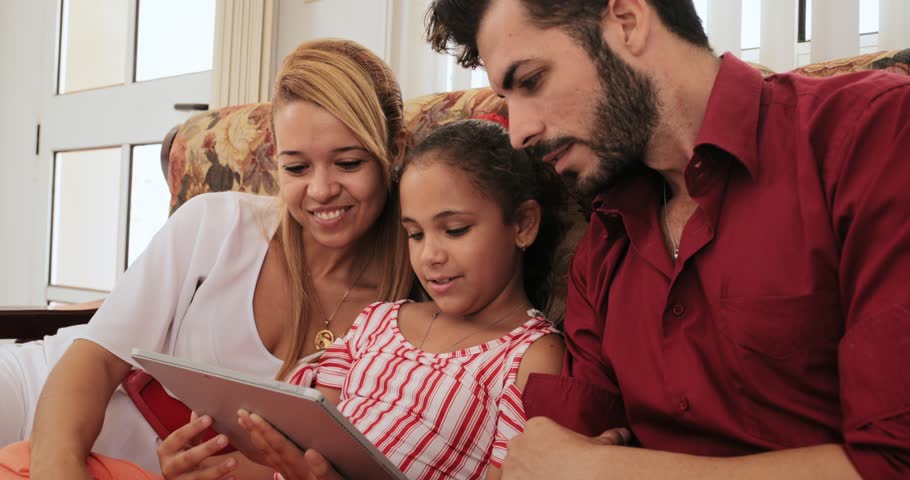 Happy Family At Home. Mother, Father And Child Playing Game With Cell ...