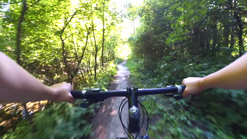 Extreme Girl Rides A Bicycle Along The River Bank. Point Of View Pov ...