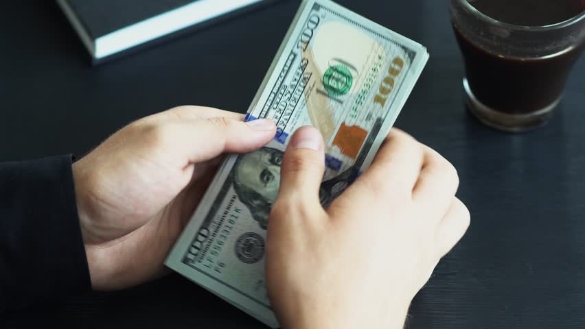 Cash Money Lot Of Hundred Stock Footage Video 100 Royalty Free Cash Money Lot Of Hundred New Dollar Banknotes Man Counting Us Dollars Financial Income Wages Loan