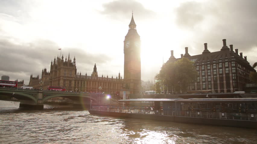 Sun Glare behind Big Ben and Westminster palace in London, England.