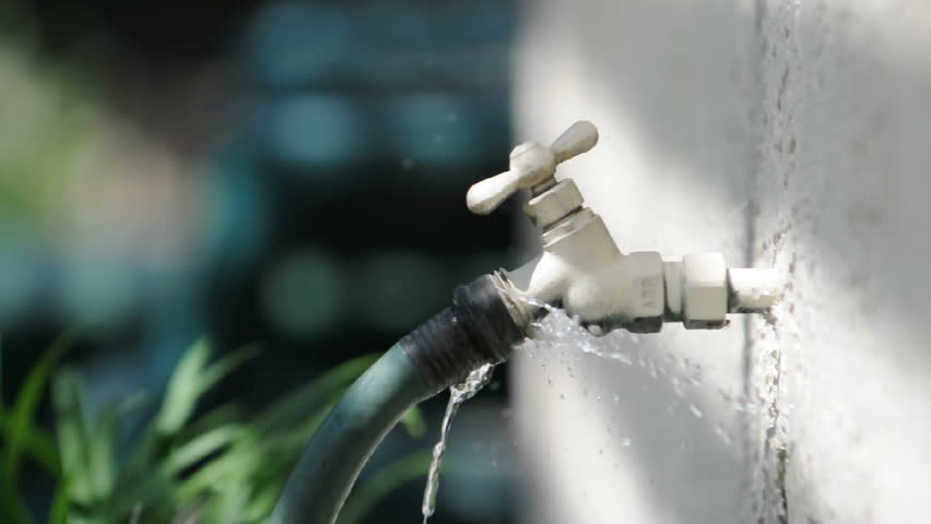 A Water Hose Leaks Outside Stock Footage Video 100 Royalty