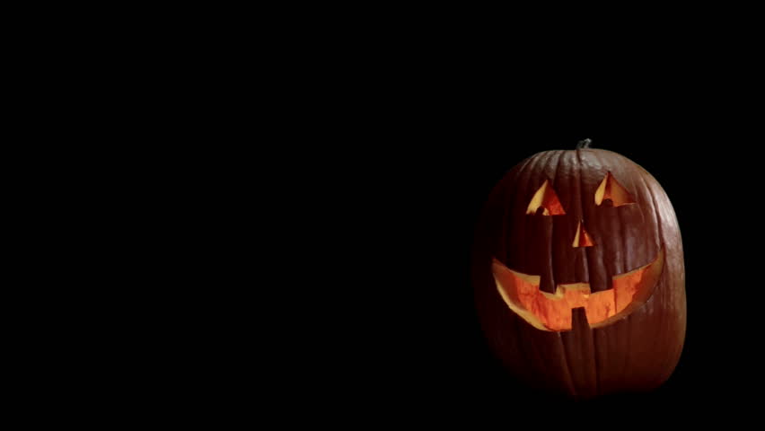 halloween carved pumpkin on a black background with room for graphics hd stock footage - Halloween Background Video halloween carved pumpkin on a black background with room for graphics hd stock footage - Halloween Background Video