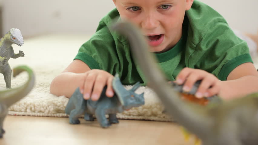 Image result for young boy with dinosaur