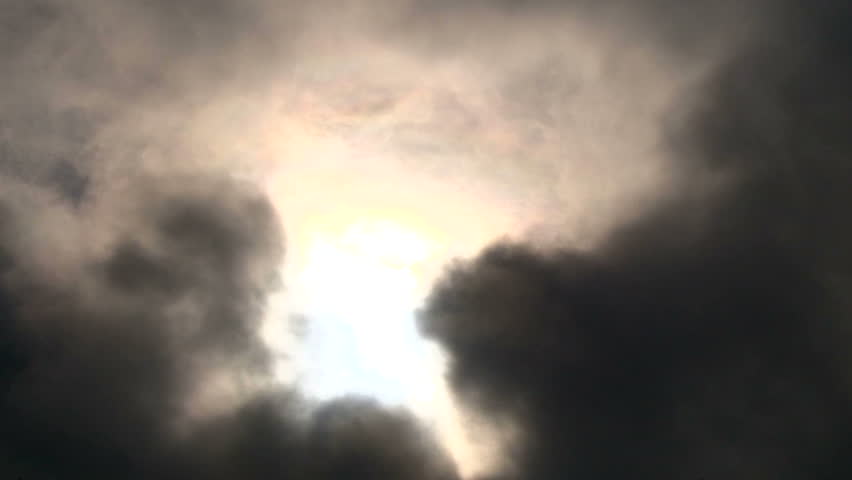 Stock video of cloudscape with sun shining behind dark | 4720415 ...