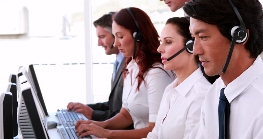 Call Centre Agents Working And Talking On Headsets In The Office 4k Stock Clip Happy Call Centre Agent Looking To In The Office Stock