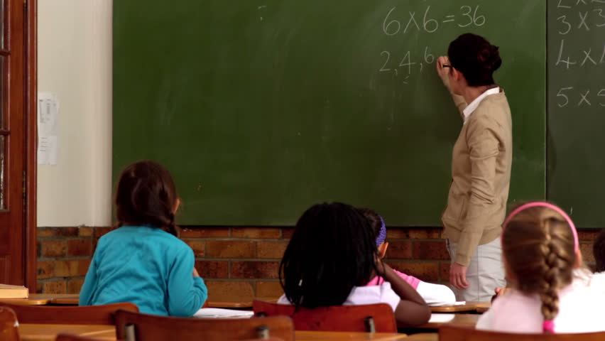 Zrenjanin Serbia March 30 2017 Teacher Write On The Table Board Teacher Teaching Math To Her Young Pupils In Clroom Slow Motion Hd Stock Video