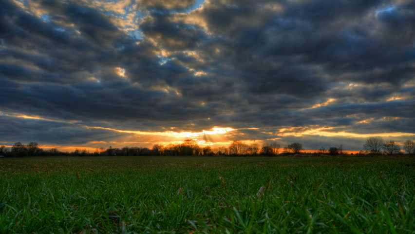 Peaceful Meadow At Sunset / Sunrise With Cloudy Sky And Mountains In ...