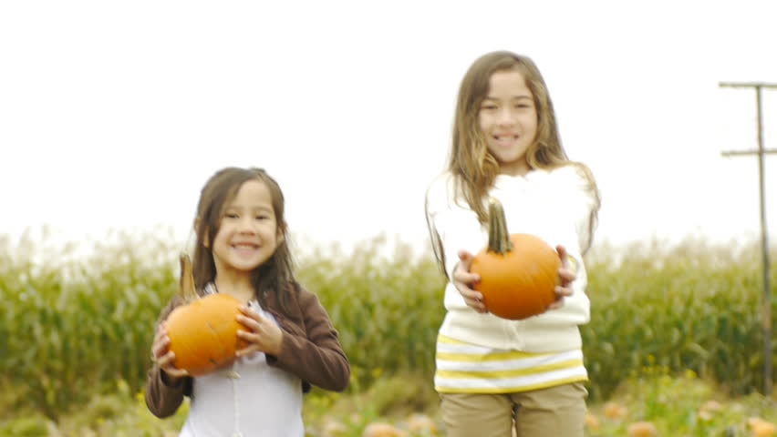 Closeup Of Happy Pre Teen Girl Carrying Her Pumpkin Stock