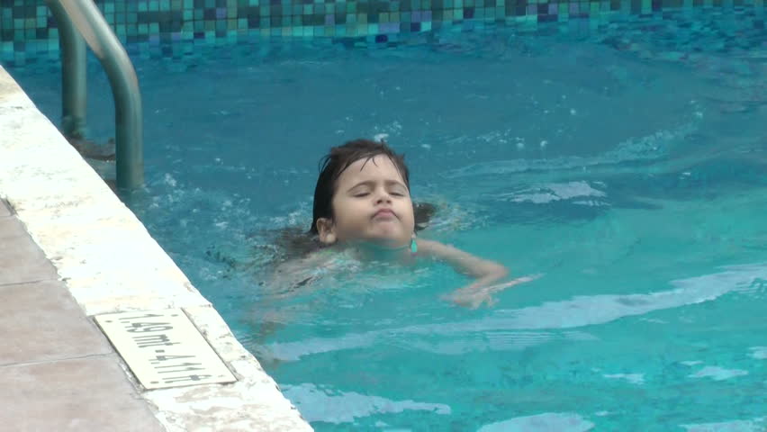 Little Girl Lies On Her Back And Swims In Pool Water Stock Footage ...