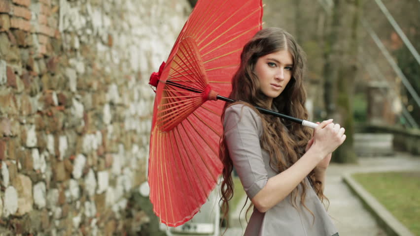Fashion Model With Extremely Long Curly Hair Poses With Beautiful