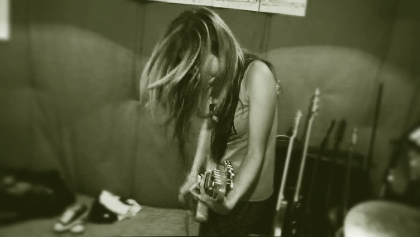 Hd00 24rock And Roll Time A Girl With Long Hair Is Actively Playing A